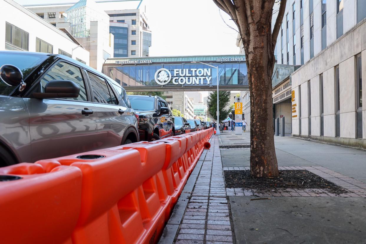 Orange barriers surround the Fulton County courthouse in Atlanta, where District Attorney Fani Willis is expected any day to seek grand jury indictments over alleged efforts to overturn the state’s 2020 election results.