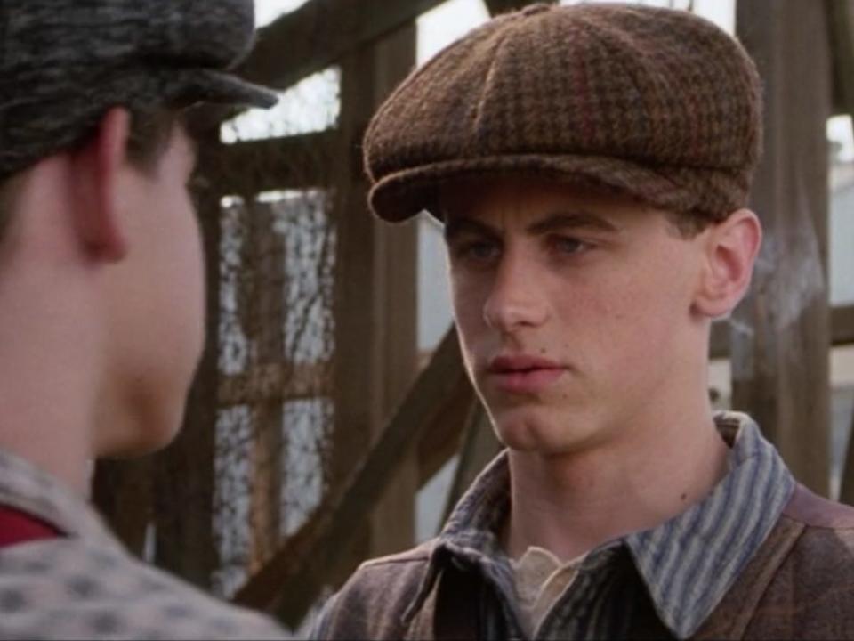 David Moscow as Davey wearing a paper boy hat talking to spot conlan during the brooklyn bridge scene