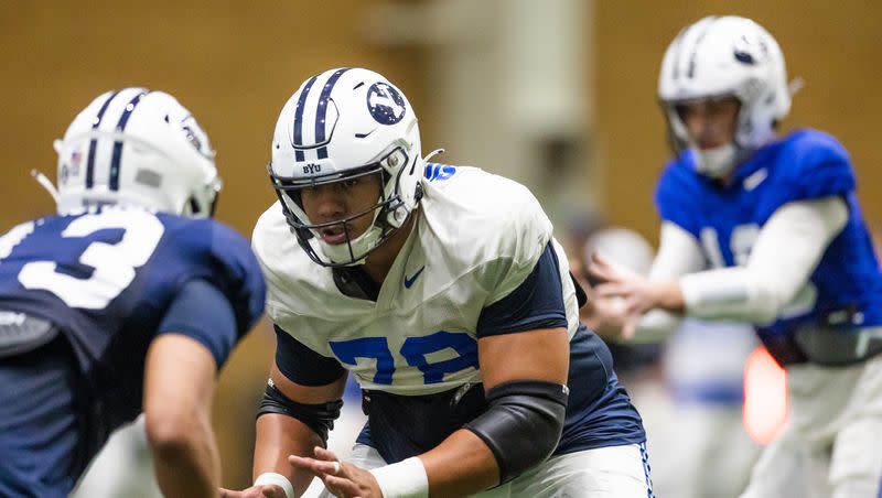 BYU offensive lineman Kingsley Suamataia prepares to block during spring practice at the indoor practice facility in Provo on March 10, 2023.