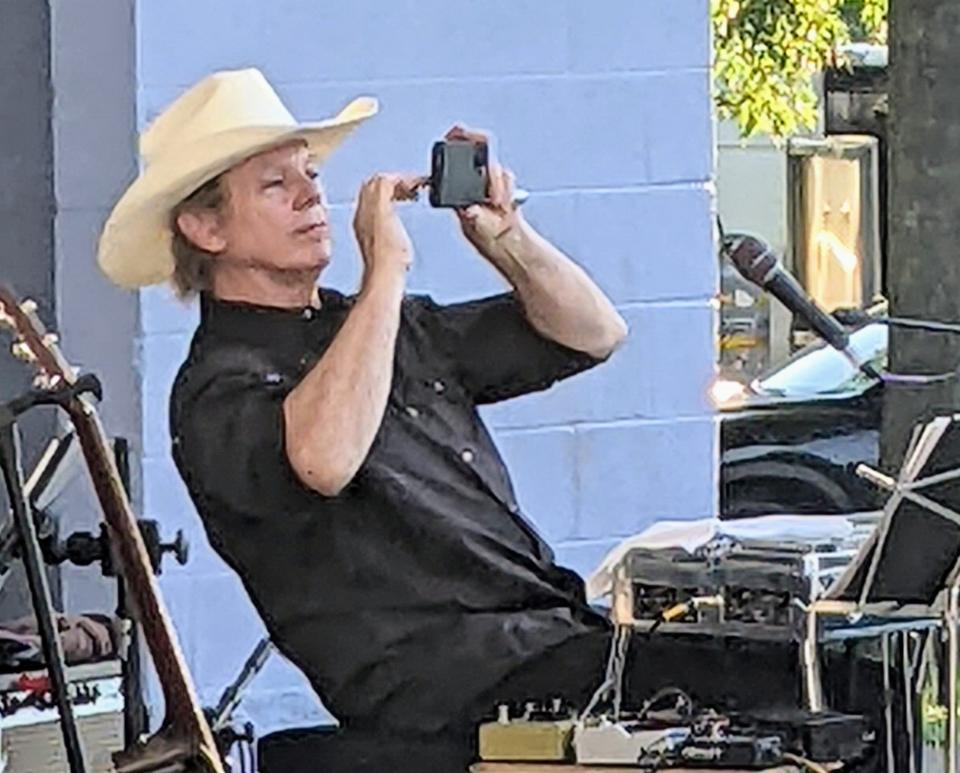 Pedal steel player Tommy Hannum snaps a picture of the Summer Sessions audience in Oak Ridge.