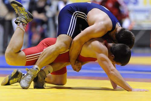 <div class="caption-credit"> Photo by: Shutterstock</div><div class="caption-title">4. Wrestling</div>I have a boy who loves to wrestle - and often uses me as his unsuspecting opponent. It's a great way to stay active and in shape. Plus, you have to use great thinking skills trying to figure out the next move before the other guy does. <br> <br> <a rel="nofollow noopener" href="http://blogs.babble.com/dadding/2012/07/03/the-top-8-olympic-events-i-cant-wait-to-watch-with-my-daughter/" target="_blank" data-ylk="slk:Related: Top 8 Olympic events to watch with your kids;elm:context_link;itc:0;sec:content-canvas" class="link "><b><i>Related: Top 8 Olympic events to watch with your kids</i></b></a>