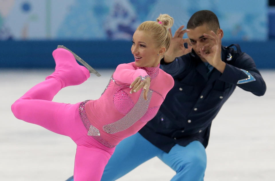 Aliona Savchenko and Robin Szolkowy of Germany compete in the pairs short program figure skating competition at the Iceberg Skating Palace during the 2014 Winter Olympics, Tuesday, Feb. 11, 2014, in Sochi, Russia. (AP Photo/Ivan Sekretarev)