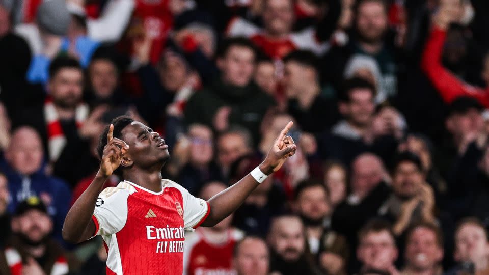 Bukayo Saka celebrates after scoring Arsenal's first goal of the game. - Adrian Dennis/AFP/Getty Images