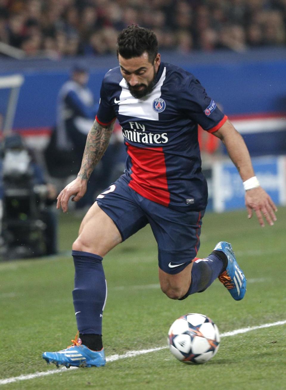 PSG's Ezequiel Lavezzi runs with the ball during the Champions League round of 16 second leg soccer match between Paris Saint Germain and Bayer Leverkusen at the Parc des Princes stadium in Paris, Wednesday, March 12, 2014. (AP Photo/Christophe Ena)