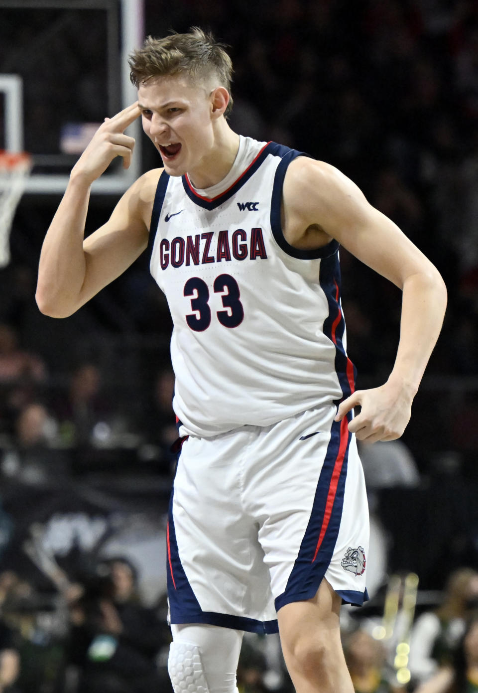 Gonzaga forward Ben Gregg (33) reacts after a 3-point basket against San Francisco during the second half of an NCAA college basketball game in the semifinals of the West Coast Conference men's tournament Monday, March 6, 2023, in Las Vegas. (AP Photo/David Becker)