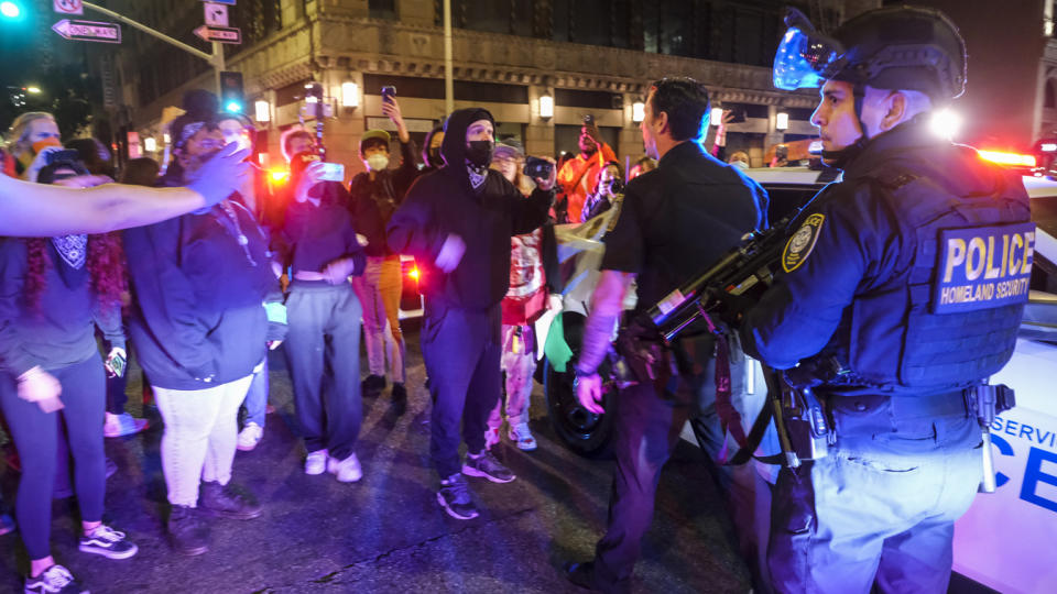 Abortion rights demonstrators clash with police officers in Los Angeles on Tuesday night. (Ringo H.W. Chiu/AP Photo)