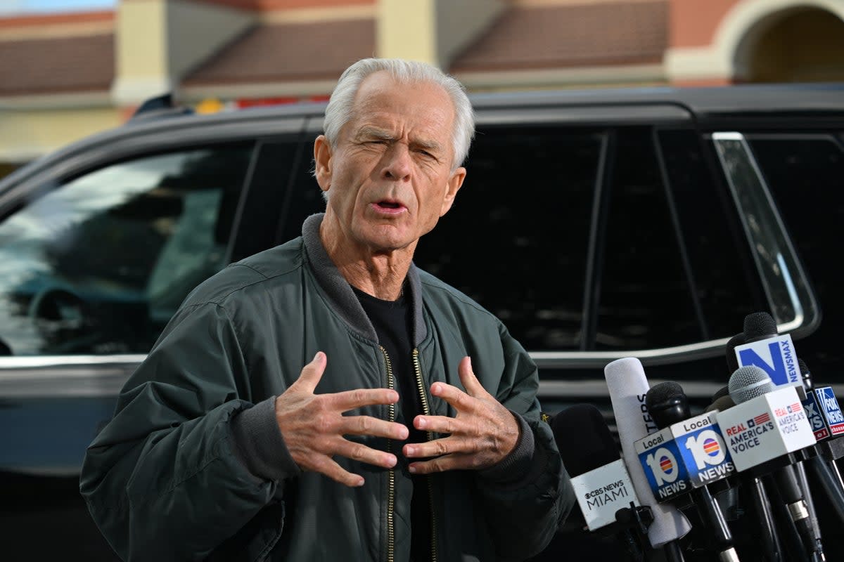 Peter Navarro, White House trade advisor to former US President Donald Trump, speaks to the press at the Country Mall Plaza before reporting to the Federal Correctional Institution, in Miami, Florida on 19 March 2024 (AFP via Getty)