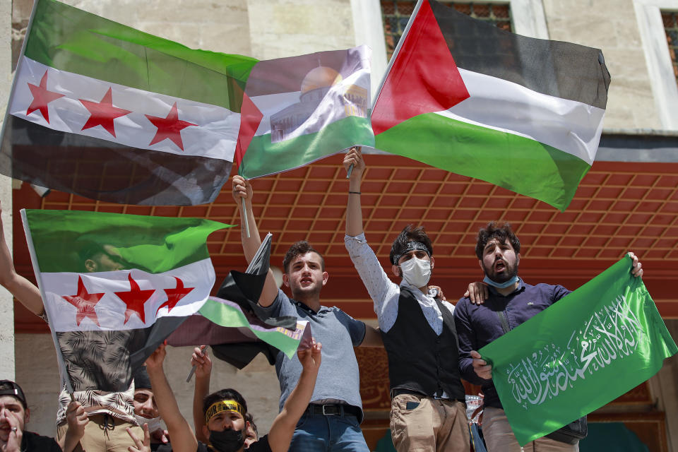 Protesters gather during a rally outside Fatih mosque in Istanbul following Friday prayers, Friday, May 4, 2021, in support of Palestinians, killed in the recent escalation of violence in Jerusalem and the Gaza Strip. People in Turkey have been demonstrating against Israel this week and have gathered without much interference from the police despite a strict lockdown to curb COVID-19 infections that have ordered people to stay home until May 17.(AP Photo/Emrah Gurel)