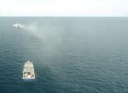 Plume from a seawater sprayer is seen during the second field trial at Broadhurst Reef on the Great Barrier Reef