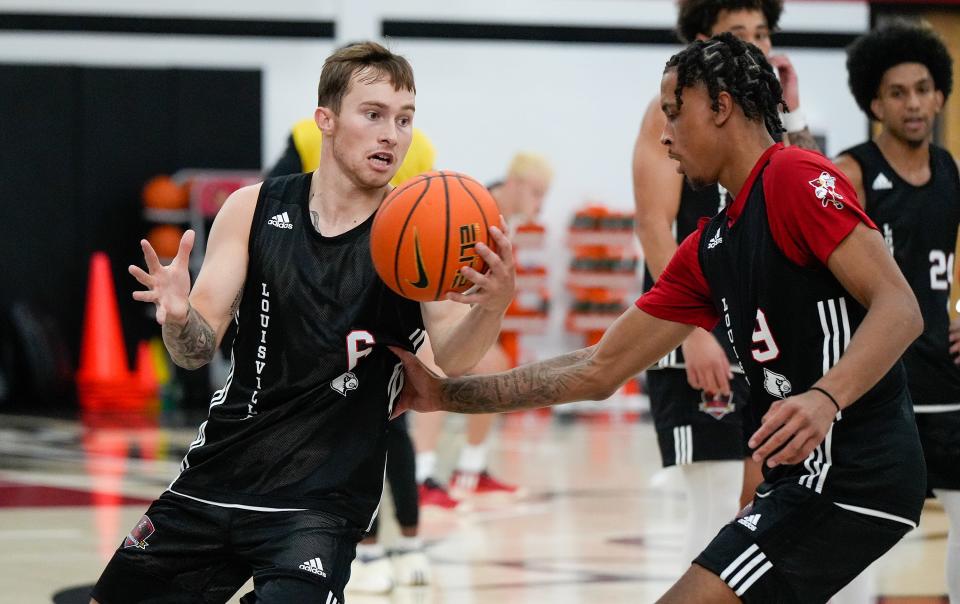 Reyne Smith dribbles against Khani Rooths during practice before the Cards head to the Bahamas. July 26, 2024