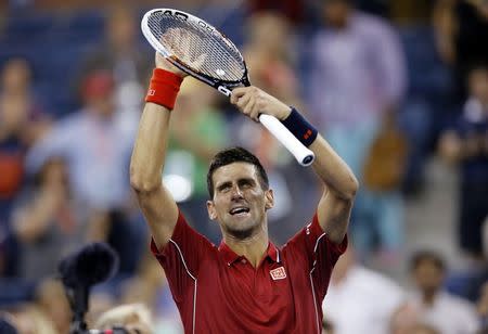 Novak Djokovic of Serbia celebrates his win over Diego Schwartzman of Argentina during their match at the 2014 U.S. Open tennis tournament in New York August 25, 2014. REUTERS/Shannon Stapleton