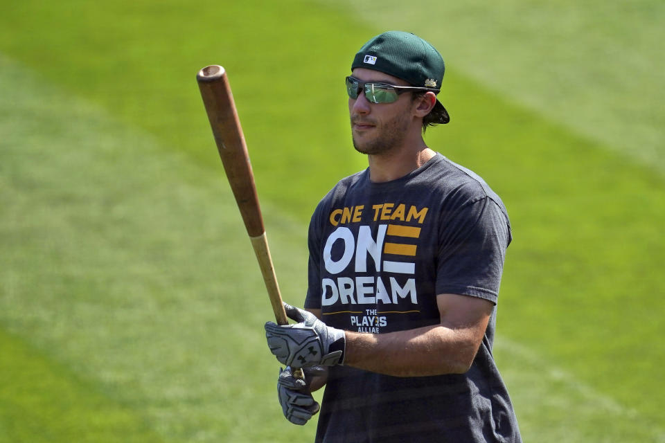 Oakland Athletics' Matt Olson walks on the field during a baseball workout in Oakland, Calif., Monday, Sept. 28, 2020. The Athletics are scheduled to play the Chicago White Sox in an American League wild-card playoff series starting Tuesday. (AP Photo/Jeff Chiu)