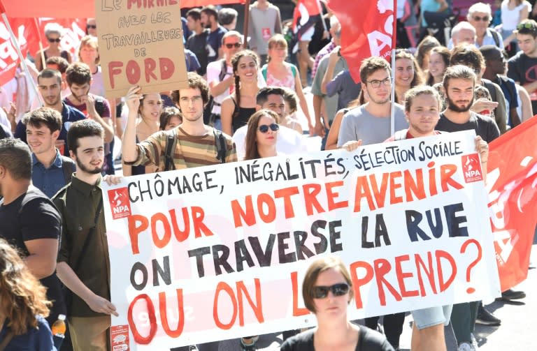 A recent poll found just 29 percent of the French satisfied with Macron's leadership: Sign reads "For our future, do we cross the street or do we take it?" a reference to Macron's comment to an unemployed gardener who complained he could not find a job