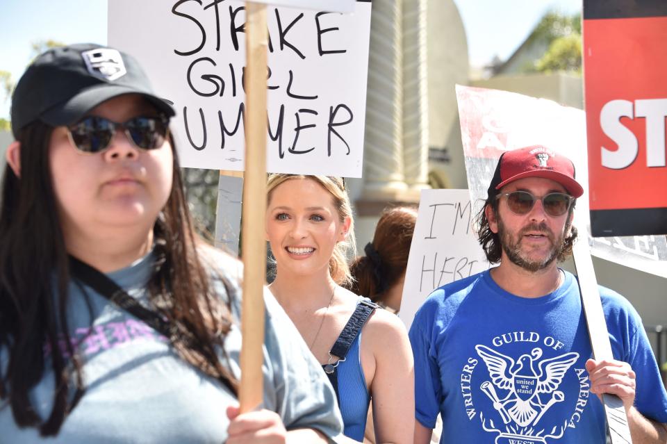 Greer Grammer walks a picket line with members of the Writers Guild of America and the Screen Actors Guild outside Paramount Studios in Los Angeles, California, on July 14, 2023.