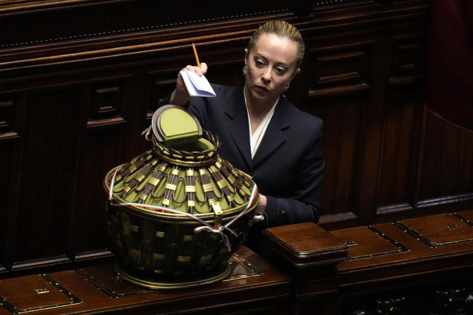 FILE - Brothers of Italy's leader Giorgia Meloni votes to choose the Chamber president in the Italian lower Chamber, on the opening session of the new parliament, in Rome, Thursday, Oct. 13, 2022. As a young teen, Italy's Giorgia Meloni embarked on an ideological quest that has propelled her to the verge of government power. The Sept. 25 election victory of her Brothers of Italy, a party with neo-fascist roots that she helped establish a decade ago, provided Meloni with a springboard into the Italian premiership. (AP Photo/Alessandra Tarantino, File)