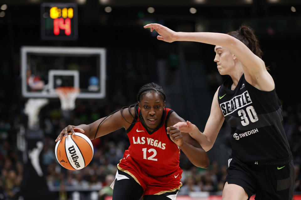 Las Vegas Aces point guard Chelsea Gray dribbles against the Seattle Storm's Breanna Stewart during the second quarter in Game 4 of the 2022 WNBA semifinals at Climate Pledge Arena in Seattle on Sept. 6, 2022. (Steph Chambers/Getty Images)