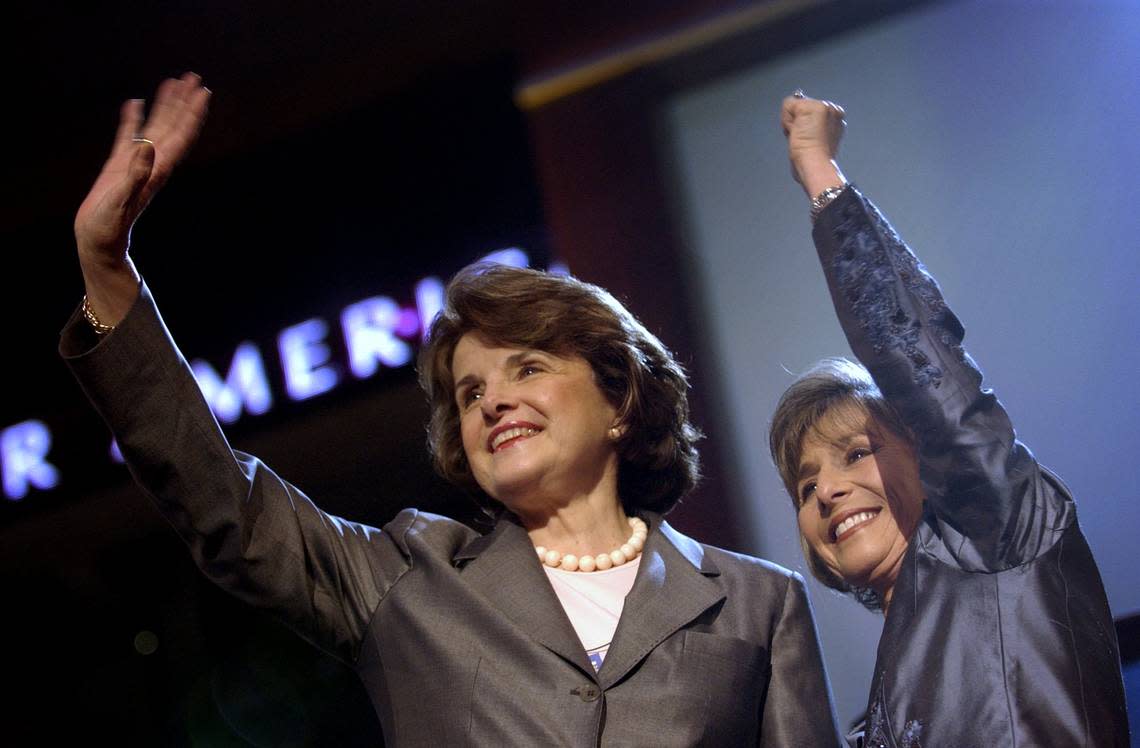 California Sens. Dianne Feinstein and Barbara Boxer wave to the state delegation at the Democratic Convention in Boston on Monday, July 26, 2004. The two were among the nine female U.S. Senators that were honored during a ceremony on the floor of the convention.