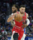 Chicago Bulls guard Zach LaVine (8) is fouled by Detroit Pistons forward Saddiq Bey during the second half of an NBA basketball game, Wednesday, Oct. 20, 2021, in Detroit. (AP Photo/Carlos Osorio)