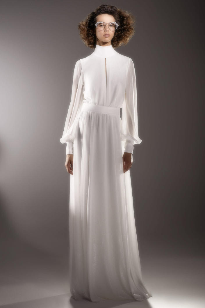<p>The combination of bishop sleeves, a high neckline, and a keyhole cutout makes this dress the perfect, casual pick for a small ceremony.</p>