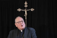 FILE - In this Sept. 30, 2019 file photo, Cardinal Timothy Dolan, archbishop of New York, speaks during a news conference in New York. Dolan established a victim compensation fund in 2016, as a successful battle to lift the statute of limitations on the filing of child sexual abuse lawsuits gathered steam. In 2020, the Archdiocese of New York received 15 loans worth at least $28 million just for its top executive offices. Its iconic St. Patrick’s Cathedral on Fifth Avenue was approved for at least $1 million. (AP Photo/Mark Lennihan, File)