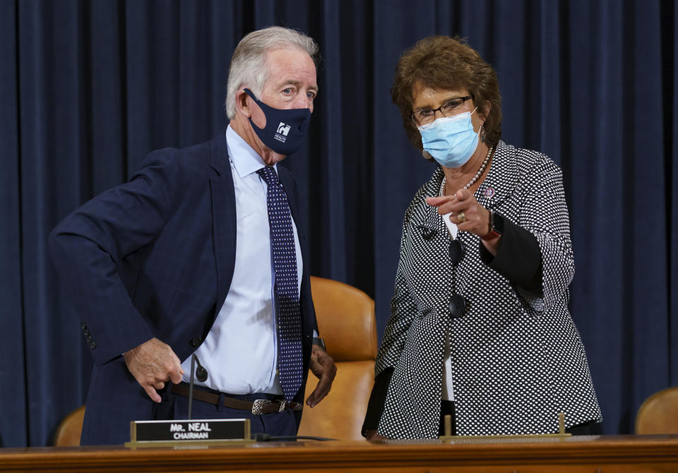 House Ways and Means Committee Chairman Richard Neal, D-Mass., left, confers with Rep. Jackie Walorski, R-Ind., as he presides over a markup hearing to craft the Democrats' Build Back Better Act, massive legislation that is a cornerstone of President Joe Biden's domestic agenda, at the Capitol in Washington, Thursday, Sept. 9, 2021. The high cost of the bill, to help families and combat climate change, would be financed in part by increasing taxes on the wealthy and corporations. (AP Photo/J. Scott Applewhite)