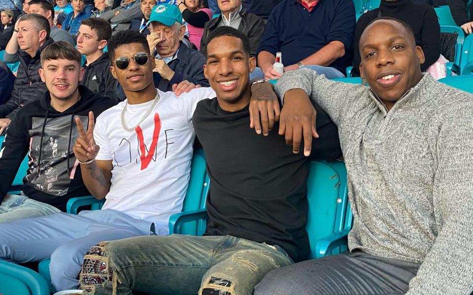 Rashford's inner circle: His best friend Jamie Hendley (far left) and brothers Dane (second from right) and Dwaine (far right)