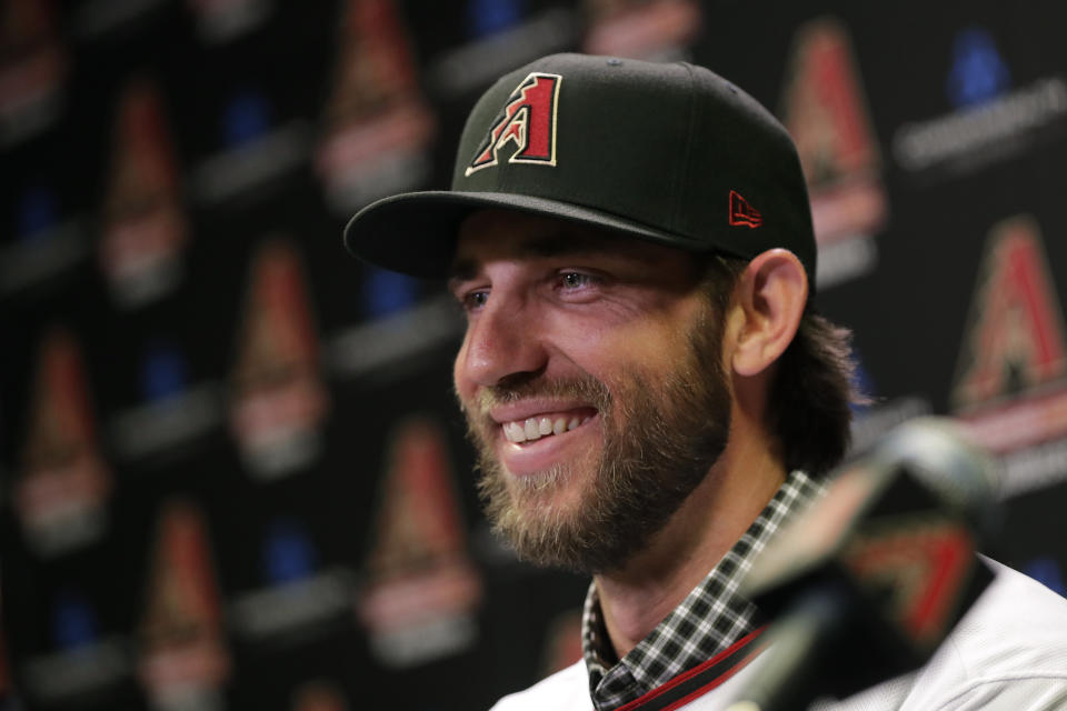 Newly acquired Arizona Diamondbacks pitcher Madison Bumgarner speaks after being introduced during a team availability, Tuesday, Dec. 17, 2019, in Phoenix. (AP Photo/Matt York)