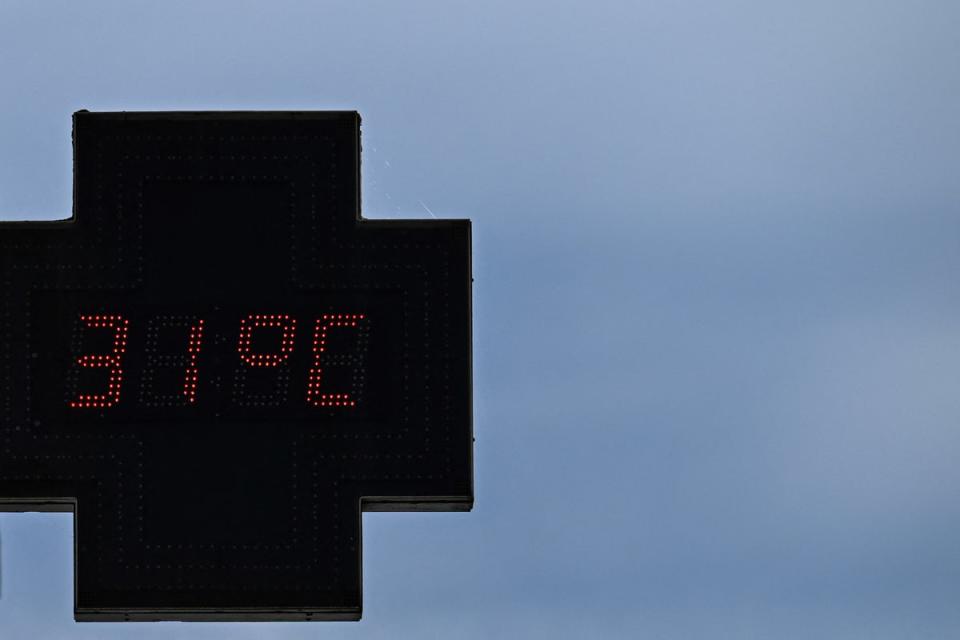 A pharmacy sign displaying the temperature 31C in Bordeaux, south-western France in April (AFP via Getty Images)