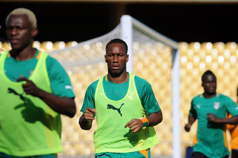 Didier Drogba (C) trains with his Ivory Coast teammates in Rustenburg, South Africa on January 21, 2013. Drogba's Elephants are favourites to win the Africa Cup of Nations and the continent's top-ranked team will be expected to dispatch Togo with ease