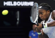 Coco Gauff of the U.S. makes a backhand return to Japan's Naomi Osaka during their third round singles match at the Australian Open tennis championship in Melbourne, Australia, Friday, Jan. 24, 2020. (AP Photo/Lee Jin-man)