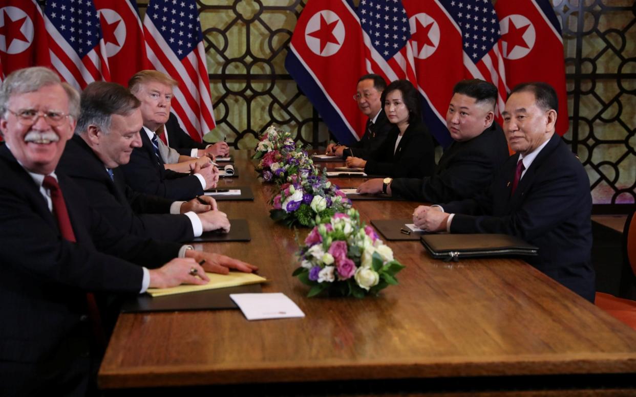 John Bolton, far left, was blamed in part for the collapse of the Hanoi summit between President Trump and Kim Jong-un - REUTERS