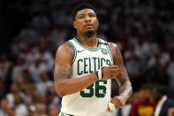 <p>Celtics shooting guard Marcus Smart <a href="https://twitter.com/smart_MS3/status/1240786953924214793" rel="nofollow noopener" target="_blank" data-ylk="slk:announced on Twitter;elm:context_link;itc:0;sec:content-canvas" class="link ">announced on Twitter</a> on March 19 that <a href="https://people.com/sports/celtics-marcus-smart-2-lakers-nba-players-test-positive-coronavirus/" rel="nofollow noopener" target="_blank" data-ylk="slk:he tested positive for the respiratory virus;elm:context_link;itc:0;sec:content-canvas" class="link ">he tested positive for the respiratory virus</a>, urging his fans and followers to practice <a href="https://people.com/health/coronavirus-difference-between-social-distancing-self-quarantining-lockdown-shelter-in-place/" rel="nofollow noopener" target="_blank" data-ylk="slk:social distancing;elm:context_link;itc:0;sec:content-canvas" class="link ">social distancing</a> to stall the spread.</p> <p>"I was tested 5 days ago and the results came back tonight, which were positive," the athlete wrote alongside a video. "I've been self-quarantined since the test, thank goodness. COVID-19 must be taken w the highest of seriousness. I know it's a #1 priority for our nations health experts, & we must get more testing ASAP."</p> <p>Smart said that he has "had no symptoms" and that he feels "great."</p> <p>"But the younger generation in our country MUST self distance," he added in <a href="https://twitter.com/smart_MS3/status/1240786956579192834" rel="nofollow noopener" target="_blank" data-ylk="slk:another tweet;elm:context_link;itc:0;sec:content-canvas" class="link ">another tweet</a>. "This is not a joke. Not doing so is selfish. Together we can beat this, but we must beat it together by being apart for a short while. Much love!!"</p> <p>On the same day, the Los Angeles Lakers announced that two unidentified players tested positive, as well.</p>