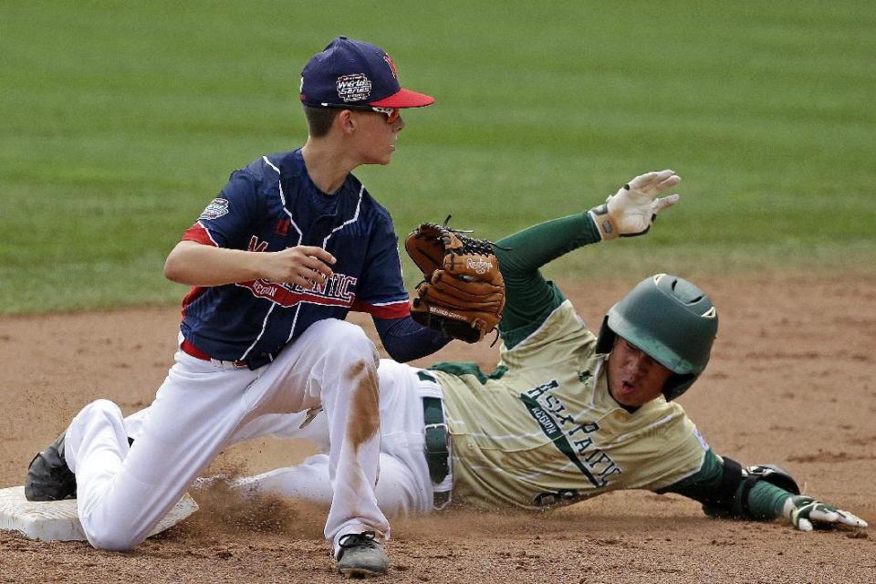 South Korea's Seum Kwon, right, is forced out at second base by Endwell, N.Y.'s Jude Abbadessa during the sixth inning of theLittle League World Series Championship baseball game in South Williamsport, Pa., Sunday, Aug. 28, 2016. (AP Photo/Gene J. Puskar)