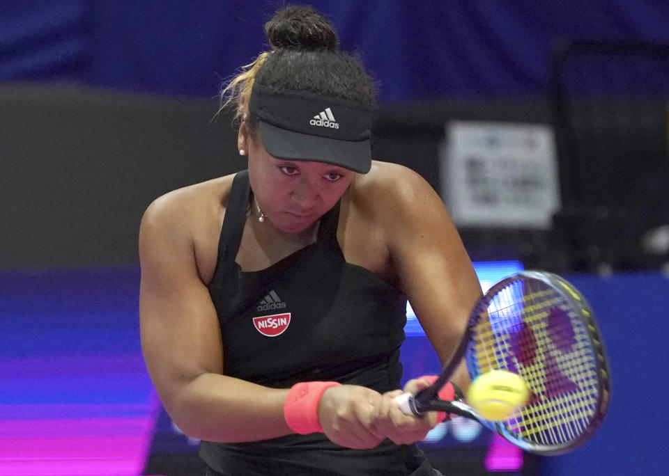 Naomi Osaka of Japan returns a shot against Karolina Pliskova of Czech Republic during the final match of the Pan Pacific Open women’s tennis tournament in Tokyo Sunday, Sept. 23, 2018. (AP Photo/Eugene Hoshiko)