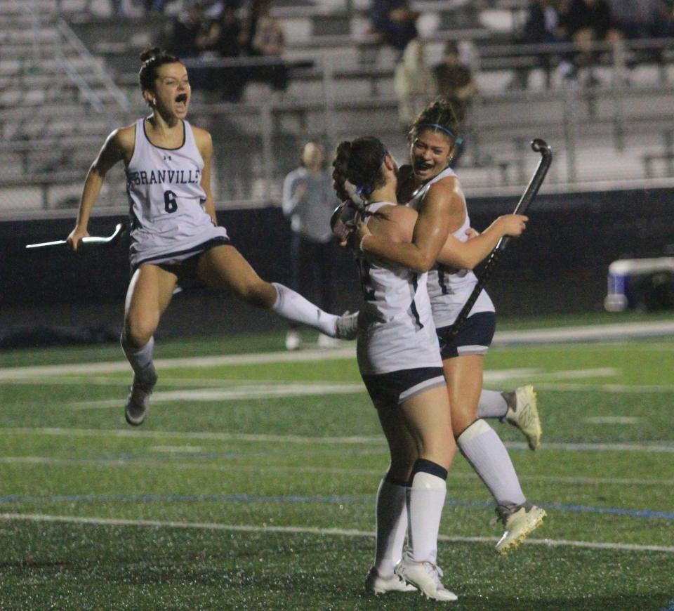 Granville's Bella Rockwell, right, celebrates her goal with Megan Lodge and Olivia Graves (6) against Olentangy Orange on Thursday.