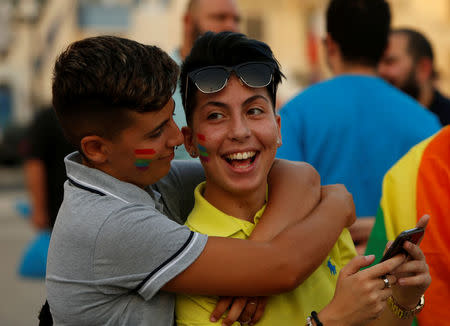 People celebrate after the Maltese parliament voted to legalise same-sex marriage on the Roman Catholic Mediterranean island, in Valletta, Malta July 12, 2017. REUTERS/Darrin Zammit Lupi