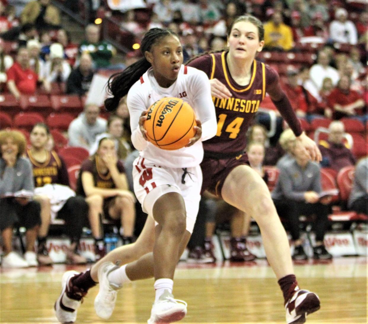 Wisconsin freshman guard Ronnie Porter drives past Minnesota's Isabelle Gradwell at the Kohl Center in Madison, Wis. on Sunday Jan. 8, 2023.