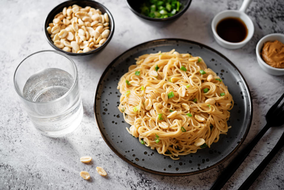 noodles tossed in peanut sauce