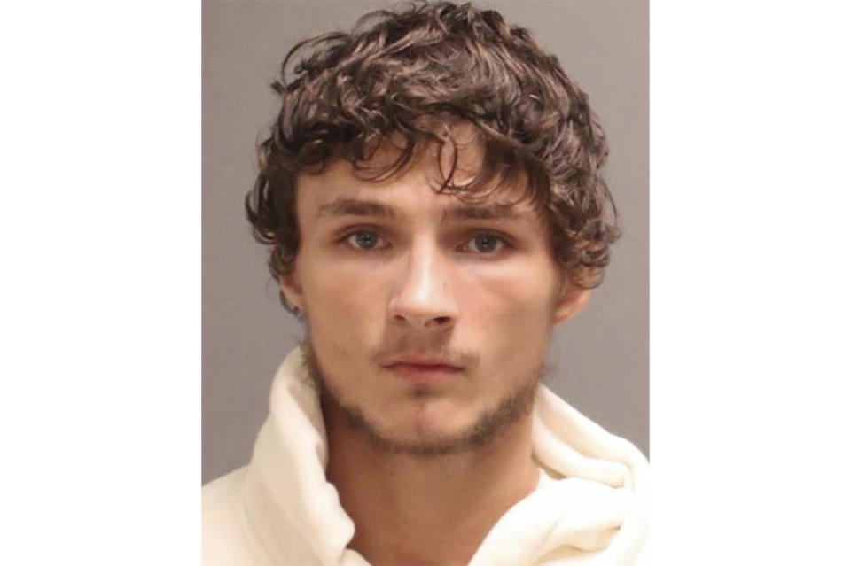 This booking photo provided by the Philadelphia Police Department shows Cody Heron. Authorities have announced an arrest, Wednesday, Oct. 4, 2023, in the case of a motorcyclist seen smashing in the back of a woman’s car while her two small children were inside in Philadelphia and then waving a gun at her after she confronted him. Prosecutors said Heron is charged with aggravated assault, reckless endangerment and possession of an instrument of crime.(Philadelphia Police Department via AP)