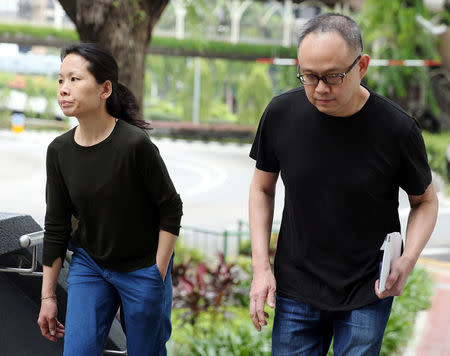 Chong Sui Foon and Lim Choon Hong, who were charged for starving their Filipino domestic helper, arrive at the State Courts for a hearing in Singapore March 27, 2017. The Straits Times/Wong Kwai Chow via REUTERS