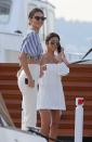 <p>For the yacht-outing, Kendall wears a cropped, blue and white striped blouse with skin-tight white jeans, both by Solace, and pair of statement sunglasses. Kourtney wears an off-the-shoulder white dress and aviator sunglasses. (Photo: Getty) </p>