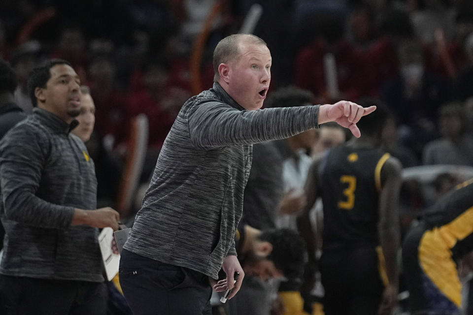 Texas A&M-Commerce coach Jaret von Rosenberg signals to players during the first half of an NCAA college basketball game against Texas in Austin, Texas, Tuesday, Dec. 27, 2022. (AP Photo/Eric Gay)