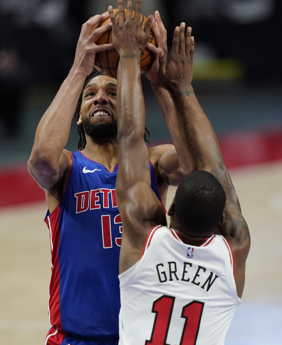 Detroit Pistons center Jahlil Okafor (13) is defended by Chicago Bulls guard Javonte Green (11) during the first half of an NBA basketball game, Sunday, May 9, 2021, in Detroit. (AP Photo/Carlos Osorio)