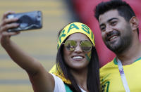 <p>A supporter takes a selfie as she waits for the start of the quarter final </p>