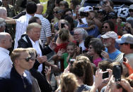 President Donald Trump visits a neighborhood impacted by Hurricane Florence, Wednesday, Sept. 19, 2018, in Conway, S.C. (AP Photo/Evan Vucci)