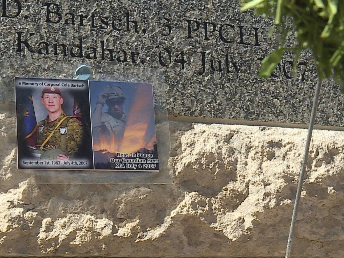 A photo of Cpl. Cole Bartsch rests on the memorial at Peacekeepers' Day ceremonies on Sunday. He was killed while serving in Afghanistan in 2007. (Jo Horwood/CBC - image credit)