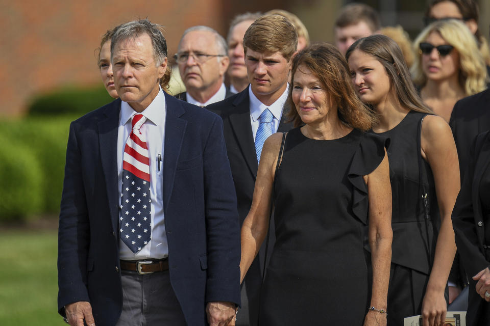 <p>Fred and Cindy Warmbier watch as their son Otto, is placed in a hearse after his funeral, Thursday, June 22, 2017, in Wyoming, Ohio. (Photo: Bryan Woolston/AP) </p>