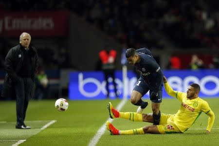 Football Soccer - Paris St Germain v Nantes French Ligue 1 - Parc des Princes, Paris, France - 19/11/16. Paris St Germain's Hatem Ben Arfa (L) challenges Nantes' Diego Carlos as coach Rene Girard (L Rear) reacts. REUTERS/Gonzalo Fuentes