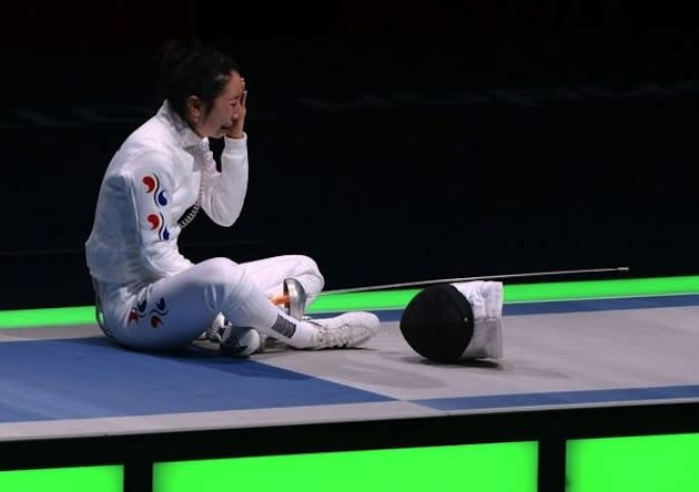 South Korean fencer Shin A Lam waits out the Korean protest of her loss — AFP