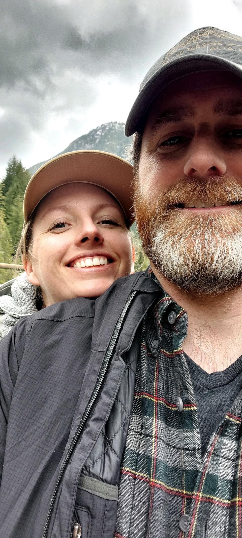 Andrew Forcier and his wife Jeni are pictured in Montana. The couple had to flee their apartment rental when they found Forcier's dad had been sitting in a bed with bed bugs for an hour.